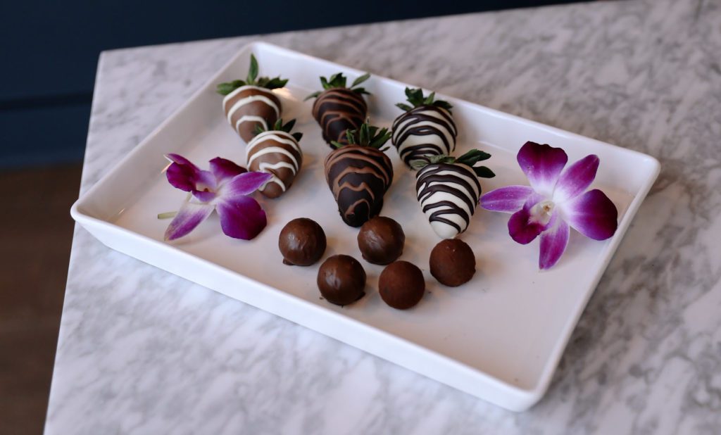 plate of chocolate covered strawberries